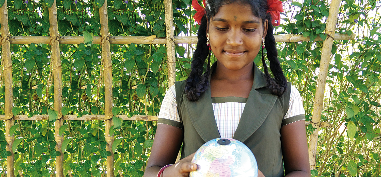 Girl with a world globe